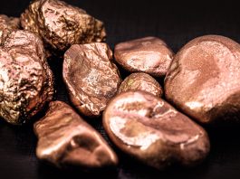 native copper nuggets isolated on black background, ore for industrial use in electrical wires and household utensils
