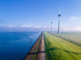 Offshore,Windmill,Park,With,Clouds,And,A,Blue,Sky,,Windmill
