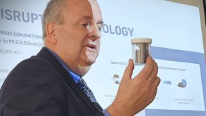 HPQ Silicon CEO Bernard Tourillon holding a container with the first samples of silicon produced by its proprietary technology (HPQ Silicon Europe)