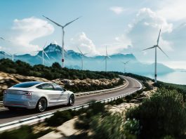 Electric,Car,Drive,On,The,Wind,Turbines,Background.,Car,Drives