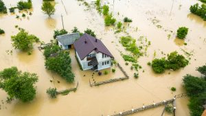 Aerial,View,Of,Flooded,House,With,Dirty,Water,All,Around