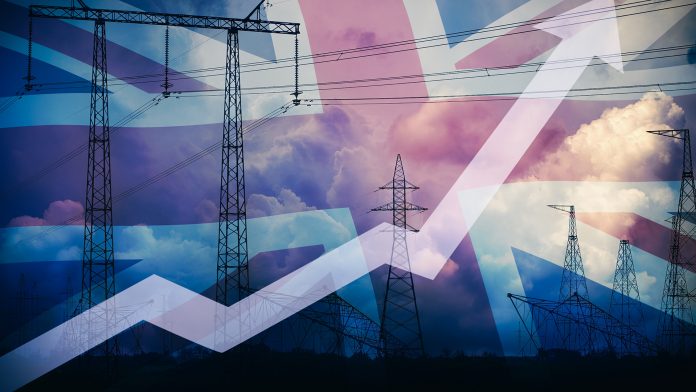 Rising,Up,Arrow,Against,Uk,Flag,And,Power,Line,Silhouette