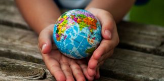 A,Boy,With,A,Ball,Of,The,World,Or,Planet