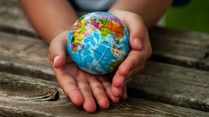 A,Boy,With,A,Ball,Of,The,World,Or,Planet