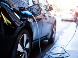 Charging,Modern,Electric,Car,On,The,Street,Which,Are,The