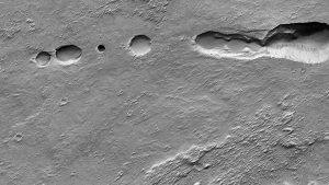 Examples of Martian pit landforms possibly connected to caves. Credit: NASA/JPL-Caltech/UArizona/PDS Geosciences Node’s Orbital Data Explorer for Mars Data Access