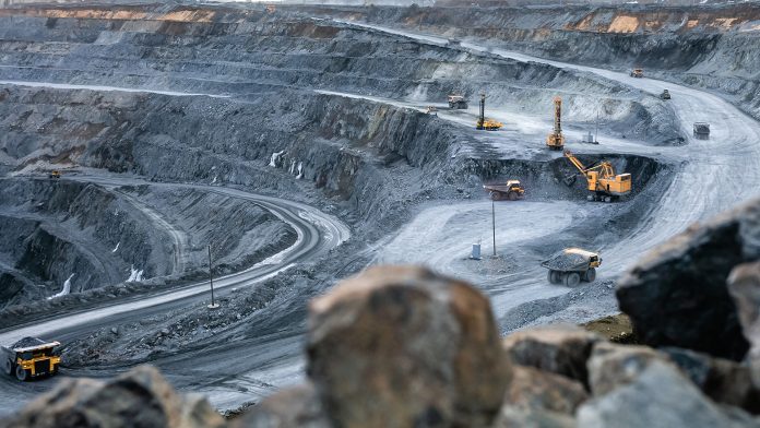 Work,Of,Heavy,Equipment,In,An,Open,Pit,For,Gold,lithium,land,rush