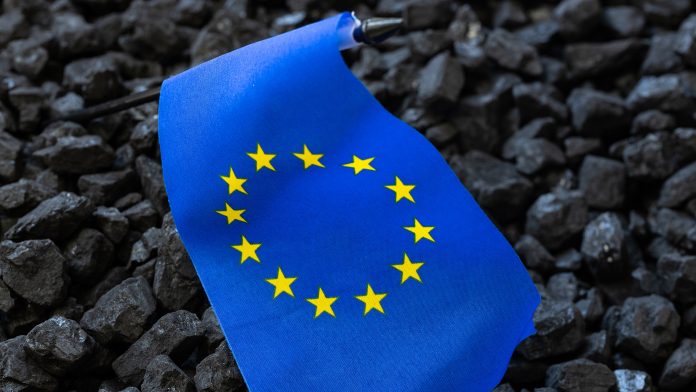 European,Union,Flag,Against,The,Background,Of,Coal,,Concept,,Coal,Rare,Earth,Supply,Chain