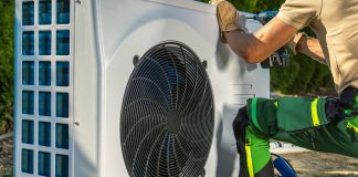 Caucasian,Hvac,Worker,Installing,Electric,Modern,And,Energy,Saving,Heat,Pump,Installation