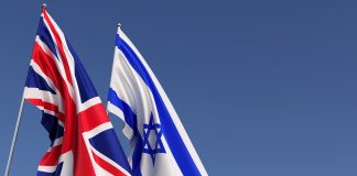 Flags,Of,The,UK,And,Israel,On,Flagpoles,On