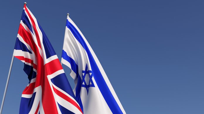 Flags,Of,The,UK,And,Israel,On,Flagpoles,On