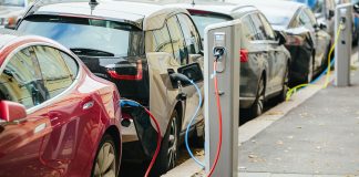 Charging,Modern,Electric,Cars,(new,Energy,Vehicles,,Nev),On,The,New,Cars,Registered