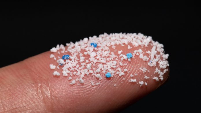 Small,Airborne,Microplastic,Pellets,On,The,Finger.micro,Plastic.,Air,Pollution