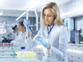 Female,Research,Scientist,Uses,Micropipette,Filling,Test,Tubes,In,A