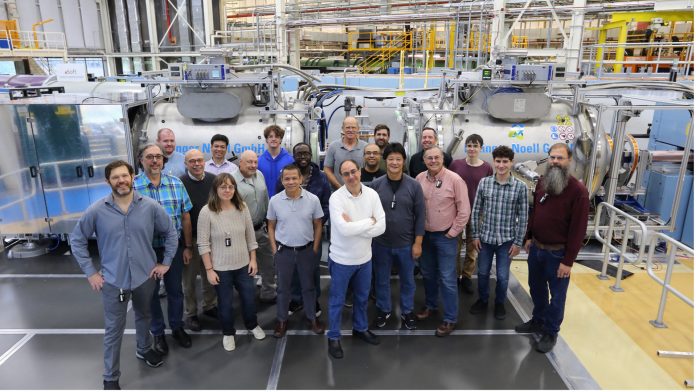 ν-NSE instrument at the NIST Center for Neutron Research (NCNR) in Gaithersburg, MD, USA, along with many of the scientists, engineers and technicians, as well as students, who worked on this successful National Science Foundation Mid-scale Infrastructure project